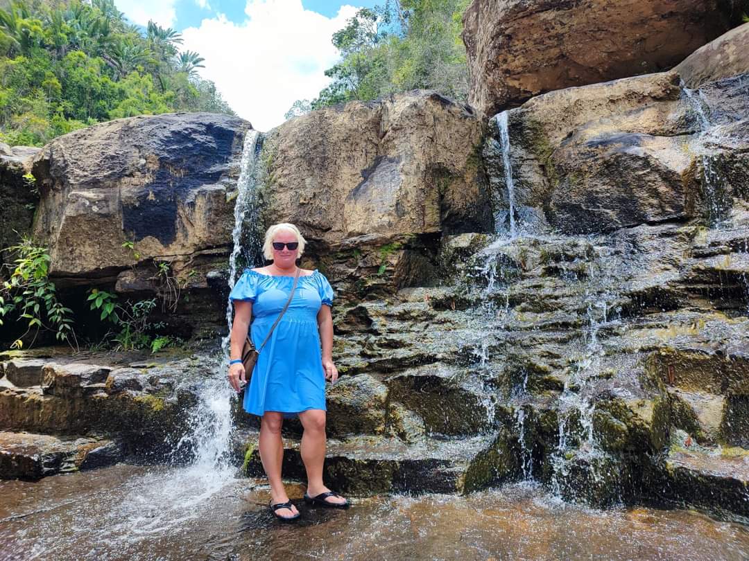 A visitor by the falls during the quad ride