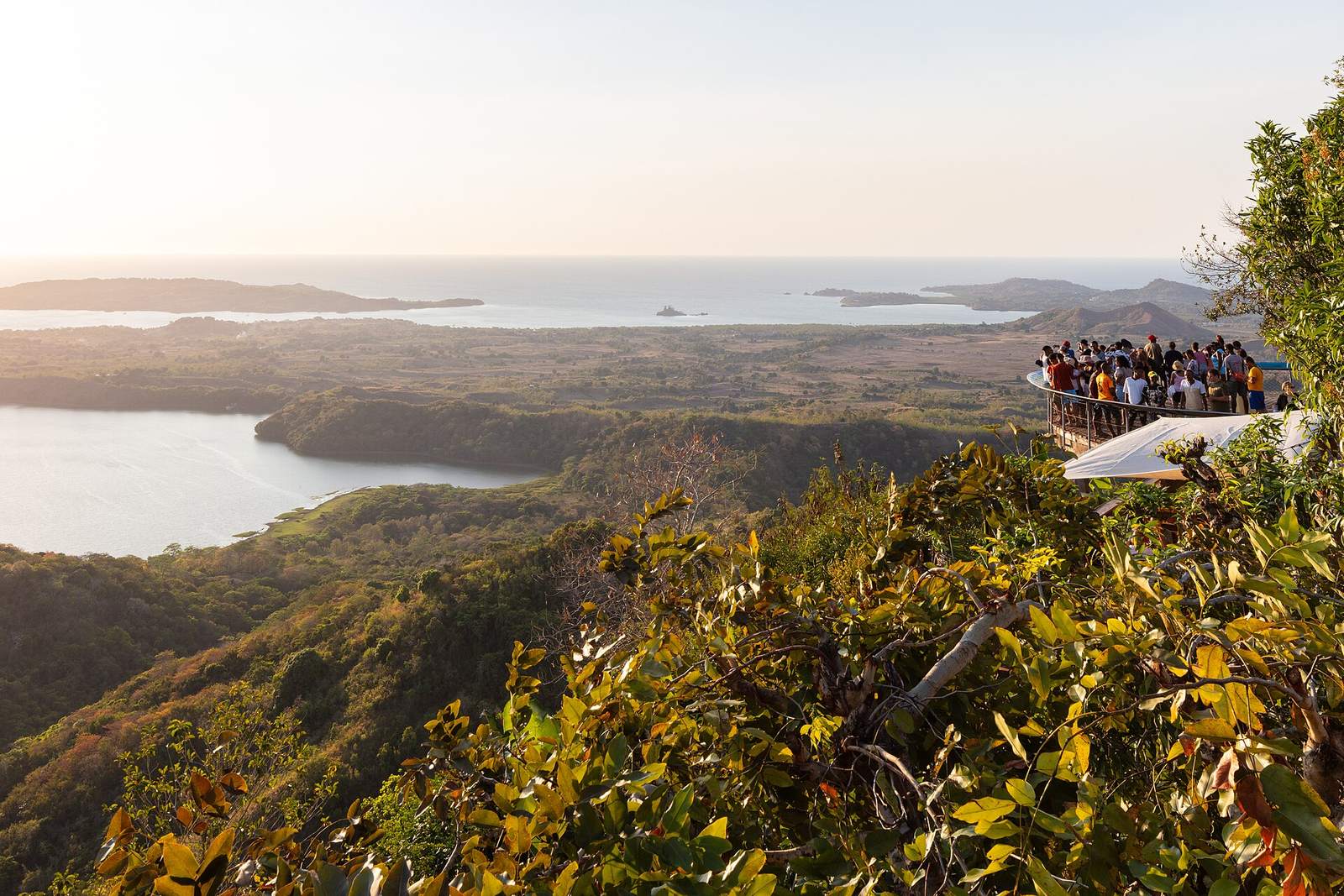 Visitors at the Mont Passot viewpoint at golden hour